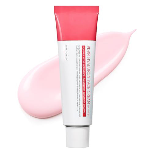 Tube of pink and white face cream on a white background